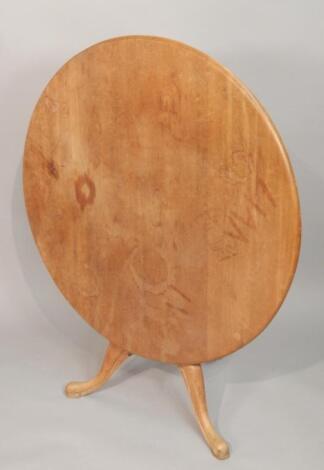 A Victorian stripped pine circular breakfast table