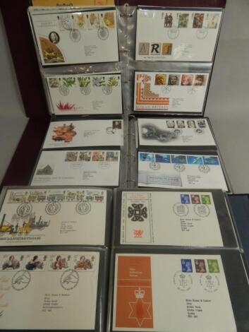 Three albums containing a large quantity of first day covers.