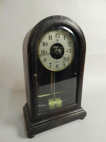 An early 20thC ebonised oak mantel clock