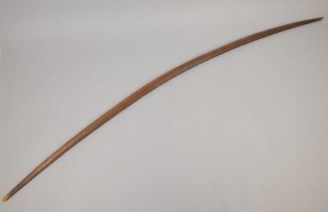 Tribal Art. A carved wooden bow