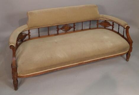 A late Victorian walnut and inlaid sofa