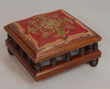 A Victorian mahogany footstool