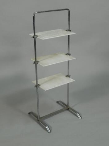 An Art Deco style chrome painted and opaque glass three tier cake stand