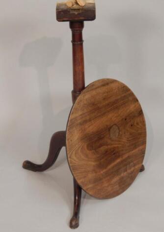 An early 20thC mahogany and fruit wood circular tilt top tripod table