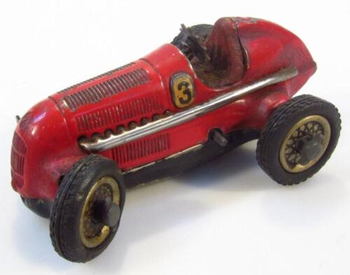 A mid-20thC Schuco Studio red pained tin plate racing car