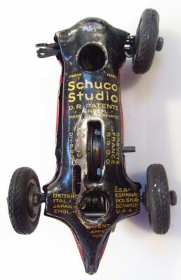 A mid-20thC Schuco Studio red pained tin plate racing car - 3