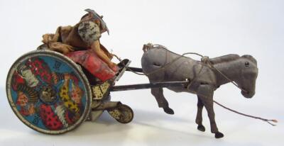 An early 20thC German tin plate horse and carriage figure group