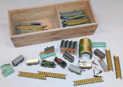 An early 20thC Bing tin plate clockwork train set