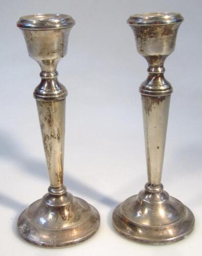 A pair of Elizabeth II silver candlesticks