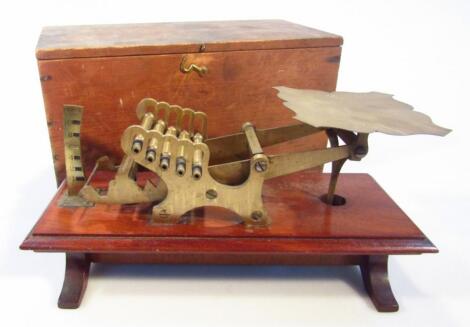 An early 20thC Willis patent brass and mahogany table scale