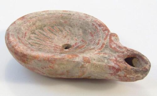 A Roman stone ware oil lamp