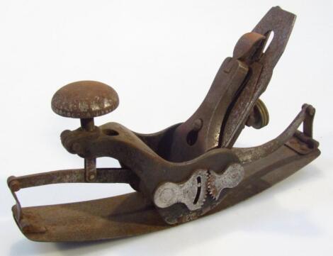 An early 20thC metal framed wood plane