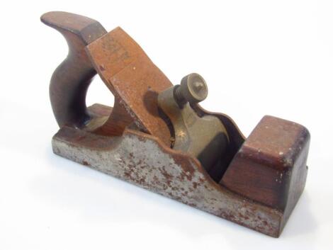 An early 20thC rosewood and metal framed wood plane