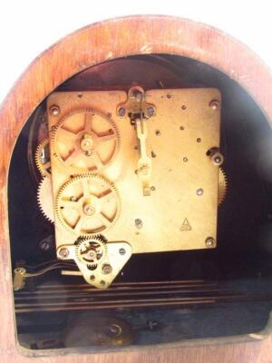 A mid-20thC oak stained mantel clock - 3