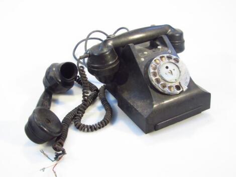 A mid-20thC black bakelite telephone