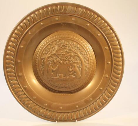 An early 20thC wall hanging brass charger