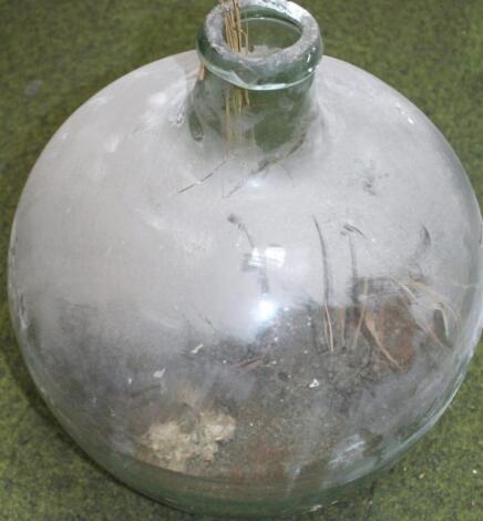 An early 20thC large glass bottle