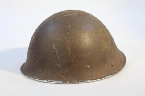 A 20thC tin war helmet