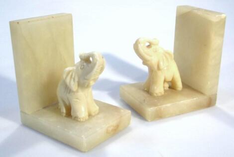 A pair of 20thC marble finish book ends