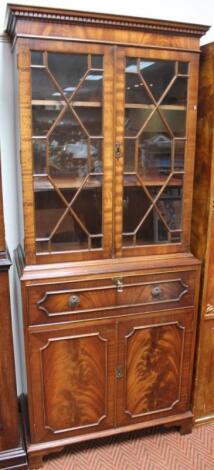 A George III style mahogany finish secretaire bookcase