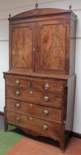 A George III mahogany bookcase on chest