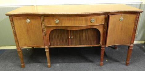 A Maple & Co walnut serpentine fronted sideboard