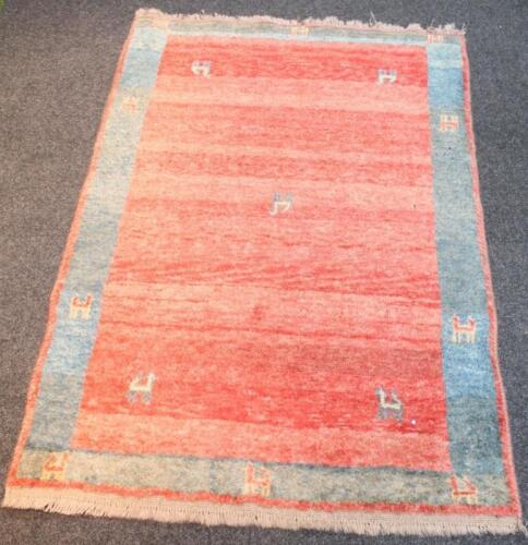 A Shiraz Gabb Tribe light red rug