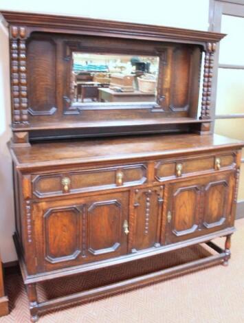 An Edwardian oak mirror back sideboard