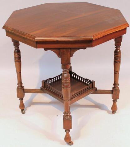 An Edwardian walnut occasional table