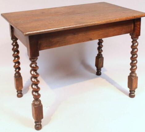 A 20thC Jacobean style oak side table