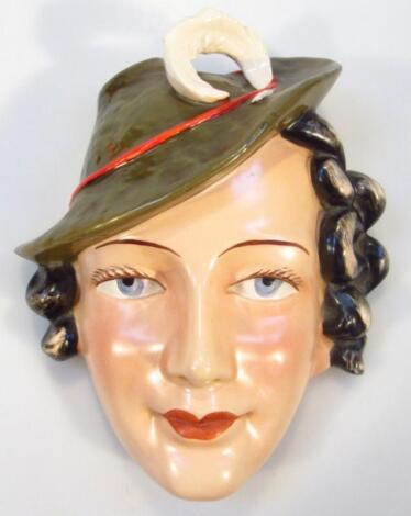 A mid-20thC Continental earthenware Art Deco facemask