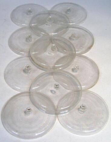 Eleven early 20thC glass lids