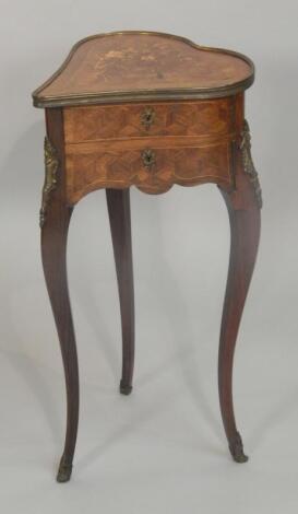 A late 19thC French rosewood marquetry and parquetry heart shaped worktable