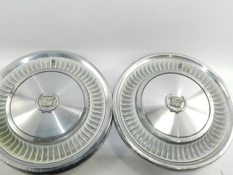 A set of four Cadillac Deville hub caps