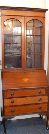 A mahogany and inlaid bureau bookcase