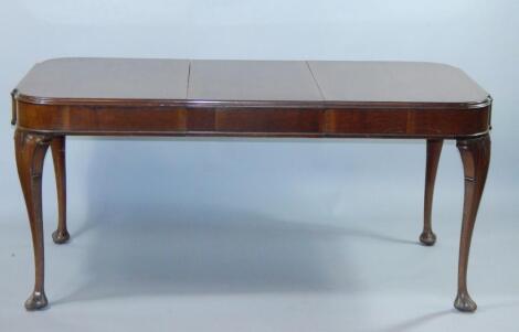 A George III style mahogany extending dining table