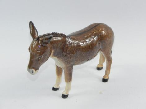 A Beswick figure of a donkey.