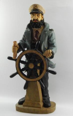 A carved wooden figure of a ship's captain
