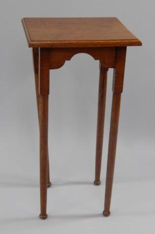 An oak jardiniere stand