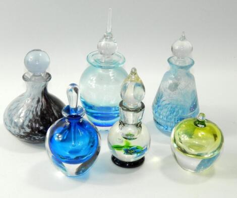 A quantity of cut glass scent bottles and stoppers