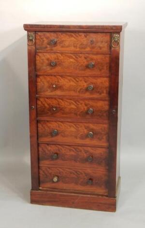 A George IV figured mahogany Wellington chest