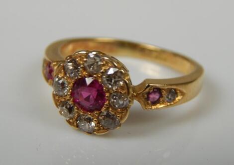 A ruby and diamond floral dress ring