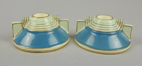 A pair of mid 20thC Art Deco Tuscan vases