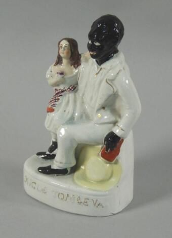 A mid 19thC Staffordshire figure of Uncle Tom & Eva
