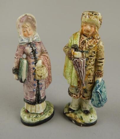 A pair of 19thC earthenware figures