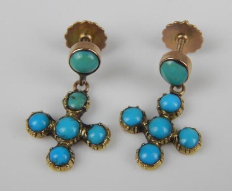 A pair of turquoise star drop earrings