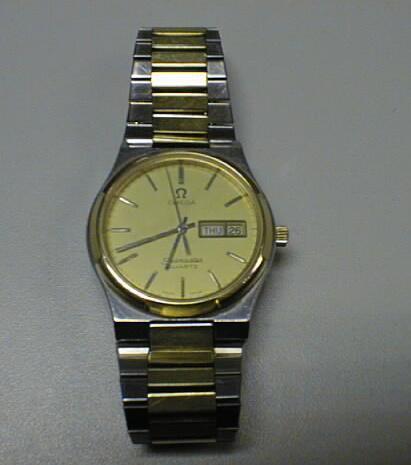 An Omega Seamaster Quartz gentleman's day date bi-colour wristwatch on integral bracelet
