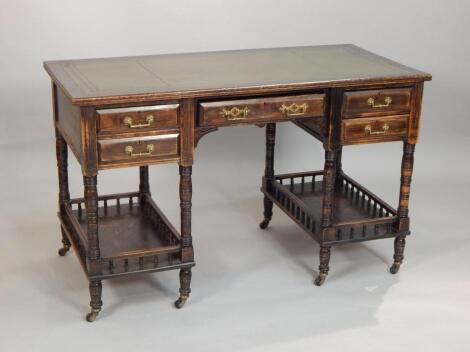 A Victorian ebonised aesthetic style writing table