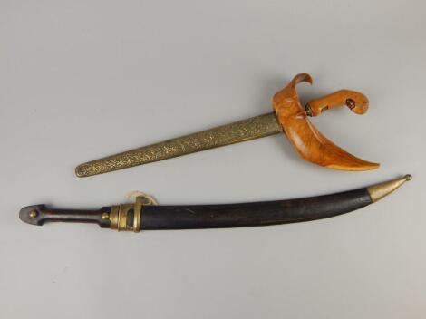 Two Eastern short swords or daggers