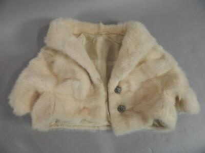 A white fur short bolero jacket